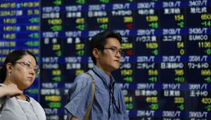 Asian shares fall from five-month highs, pound jumps on Brexit delay hopes.