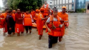 Heavy rainfall disrupts normal life in Gujarat's Vadodara; emergency helpline numbers issued.