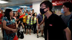 Pro-Beijing groups tear down Hong Kong's protest walls, raising risk of clashes.