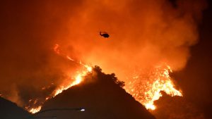 Multimillion-dollar homes burn in Los Angeles wildfire, celebrities flee.