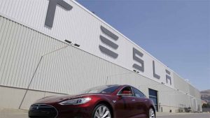 Tesla extends profit run, promises record production, driving stock up 13%.
