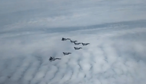 IAF Sukhoi Su-30MKIs escort Rafales as the jets move towards Ambala Air Force Station