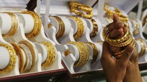 New Year Gold prices: Gold to to touch Rs 63,000 per 10 grams in 2021? Here's what experts say