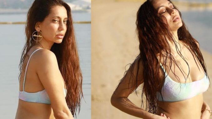 Anusha Dandekar Looks Stunning As She Poses By The Beach In A White Bikini, Pics Inside.